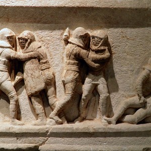 Relief of gladiatorial combat showing a rear-secured loincloth arrangement. Kibyra necropolis; Burdur Museum. Second–third century CE.