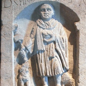 Roman funerary relief showing a craftsman wearing a neck scarf. Nièvre, France; inv. 52733. Second century CE.