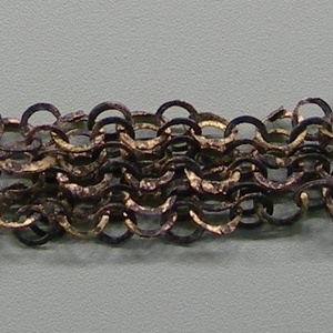 Fragment of lorica hamata with gilded rings. Courtesy Vindonissa Museum-Brugg-CH. 1-2 century AD
