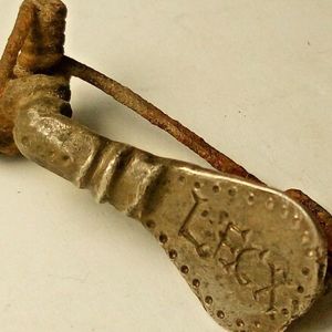 Brooch attributed to the Tenth Legion; reported material: silver. Private collection. Archaeological provenance, dating and legionary attribution are not established by the documentation provided.