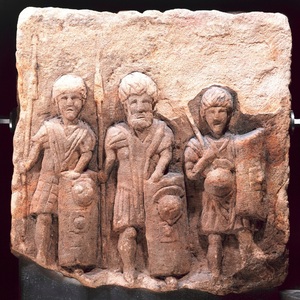 Sandstone relief depicting three legionaries with shields. Second century CE; Croy Hill on the Antonine Wall, Scotland. National Museums Scotland.