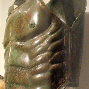 Lorica musculata. Lanuvium's warrior tomb. Bronze, there are traces of leather and linen. Maximum height: 40.8 cm, shoulders 50 cm, width: 30 cm, overall thickness: 26 cm. 490-480 year BCE
