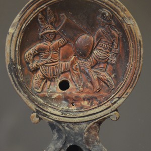 Oil lamp with a gladiator duel. 1-2 century AD