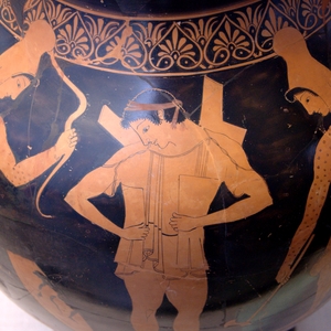 A warrior putting on a linothorax,his shoulder pads straightened behind his back. 6th century BC
