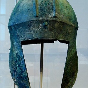 Frontal view of a bronze helmet of the Illyrian type with the image of lions. Argolis Museum. 6th-5th century BC