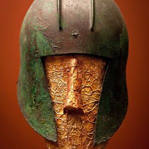 Bronze helmet and golden funeral mask. National Archaeological Museum, Athens,530-510 BC