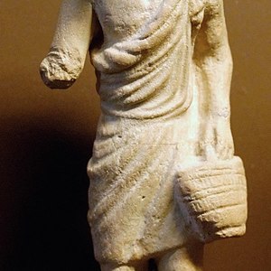 Terracotta figure of a rural worker wearing a hat. Louvre, Paris; first century BCE.