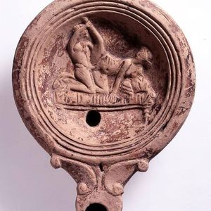 Roman oil lamp with erotic scene. The British Museum. 30-70 A.D.