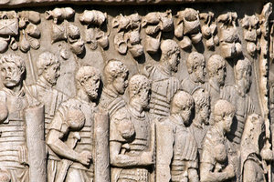 Soldiers carrying baggage on poles. Trajan’s Column, Rome; early second century CE.