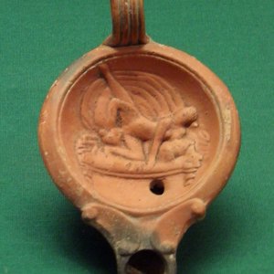 Oil lamp with erotic scene. 1-2 century AD
