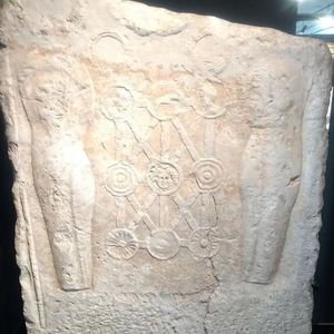 Roman relief showing military decorations and equipment. Without an inscription, their depiction does not by itself prove the owner’s centurion rank.