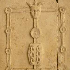 Detail of a relief showing discs with a three-horned head. Museo Lapidario Estense, Modena; first century BCE.