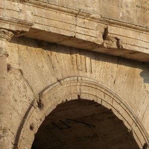 Entrance number LII (52) on the Colosseum in Rome: the ancient numbering of entrances helped organise spectator circulation. Travertine; the amphitheatre opened in AD 80. Photo: WarpFlyght, Wikimedia Commons, CC BY-SA 3.0.