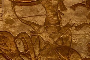 Ramesses II in a chariot in a Battle of Kadesh scene, relief of the Abu Simbel temple.