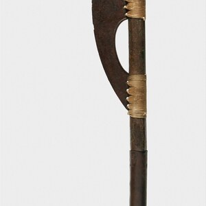 Middle Kingdom battle-ax, probably Dynasty 12: bronze blade with restored shaft and lashing. Metropolitan Museum of Art.