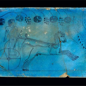 Faience tablet with a chariot scene, reign of Thutmose IV, Dynasty 18. Metropolitan Museum of Art.
