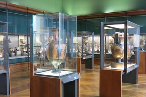 Greek antiquities room in the Louvre: sculpture and inscriptions displayed within a major international collection.