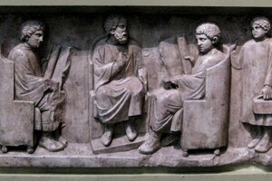 Roman relief with a school scene from Neumagen: a teacher and three pupils. c. AD 180-185; Rheinisches Landesmuseum Trier.