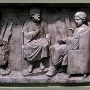 Roman relief with a school scene from Neumagen: a teacher and three pupils. c. AD 180-185; Rheinisches Landesmuseum Trier.