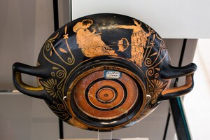 Attic kylix with a youth writing on wax tablets. c. 410 BC; Fitzwilliam Museum, Cambridge.