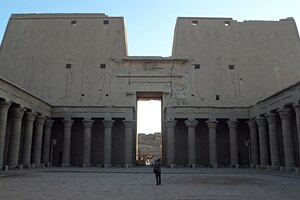 Courtyard of the Temple of Horus at Edfu looking toward the pylon. Ptolemaic period;.