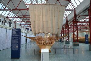 Exhibition hall of the Museum für Antike Schifffahrt with a reconstruction of an ancient sailing vessel.