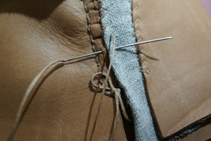 Joining upper parts and checking lace tension.