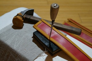 Awl and hand tools used to make holes for stitching.