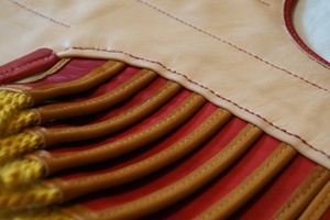 Upper edge and rows of pteruges during assembly.