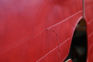 Hand stitching on a leather panel of the subarmalis.