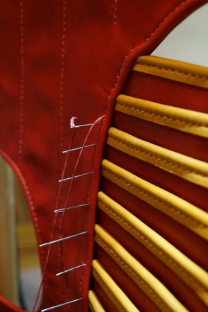 Side assembly area: joining the body and pteruges.