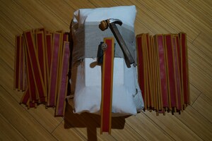 Separate pteruges, tools and a padded form during assembly.