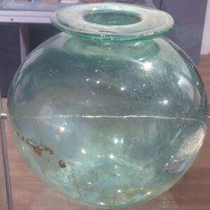 Camulodunum / Colchester: Glass urn; material-culture object or museum find connected with the site, Roman period or local archaeological context.