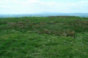 Projectiles,Ballistae,and Burnswark: Summit earthworks, Burnswark Hill - geograph.org.uk - 178737; archaeological view, find or museum context connected with the site, Roman period or local archaeological context.
