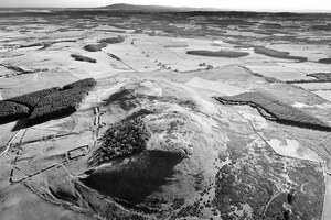 Projectiles,Ballistae,and Burnswark: Burnswark Hill aerial view from the east; archaeological view, find or museum context connected with the site, Roman period or local archaeological context.