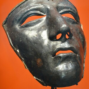Kalkriese: Kalkriese face mask for Roman cavalry helmet, Museum und Park Kalkriese, Germany; material-culture object or museum find connected with the site, Roman period or local archaeological context.