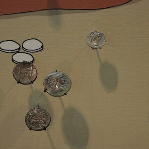 Kalkriese: Contents of the purse of a Roman soldier found on the site of the Battle of Teutoburg F...; archaeological view, find or museum context connected with the site, Roman period or local archaeological context.