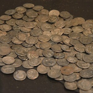 Kalkriese: Cache of silver dinarii discovered in 1987 on the site of the Battle of Teutoburg Fores...; archaeological view, find or museum context connected with the site, Roman period or local archaeological context.