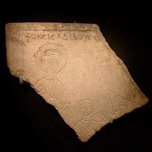 Roman Finds in Crimea: Relief fragment with a scene of the Apostle Peter walking on water; archaeological view, find or museum context connected with the site, Roman period or local archaeological context.