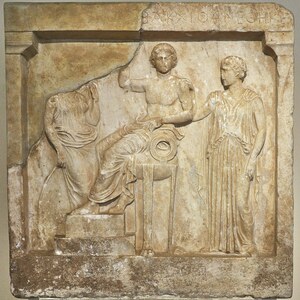 Votive relief with Apollo, Leto and Artemis (5th cent. B.C.) at the National Archaeological Museum of Athens on 4 July 2018. Экспонат из собрания: Национальный археологический музей Афин.