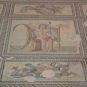Mosaic pavement depicting Aion enthroned and holding a zodiac wheel in his right hand, and a scepter in his left, 3rd century AD, from the triclinium of a Roman house in . Экспонат из собрания: Музей античного Арля.