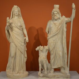 Statue group of Persephone (as Isis) and Pluto (as Serapis), from the Sanctuary of the Egyptian Gods at Gortyna, mid-2nd century AD, Heraklion Archaeological Museum (3030. Экспонат из собрания: Археологический музей Ираклиона.