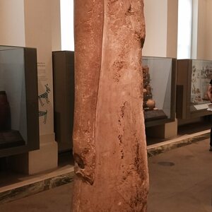 Statue of a striding man with long dress leaving one shoulder bare. Hierakonpolis, circa 3100 BCE (Ashmolean Museum AN1896-1908 E.3925). Object from the collection: Ashmolean Museum: Antiquities.