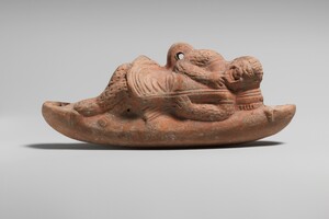Римская подвесная терракотовая лампа в форме комического актера, II век н.э.; The Metropolitan Museum of Art, инв. 17.194.1810. Public Domain. Источник: https://www.metmuseum.org/art/collection/search/250236