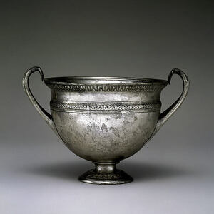 Silver skyphos, or two-handled drinking cup, mid-1st century BCE; height 9.5 cm. The underside of the foot records the vessel's weight and the owner's name, Sattia: a decorated object was also accountable property. The Metropolitan Museum of Art, acc. 20.49.2. Public Domain.