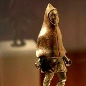 Small bronze figure of a farmer wearing a cloak, from the Trier region, third century CE.